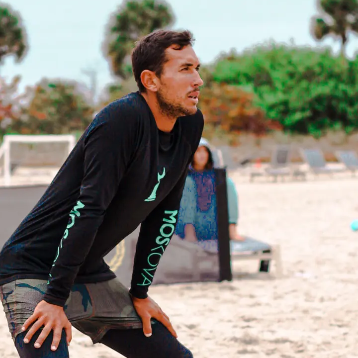 Coach Brice in a defensive stance on the sand